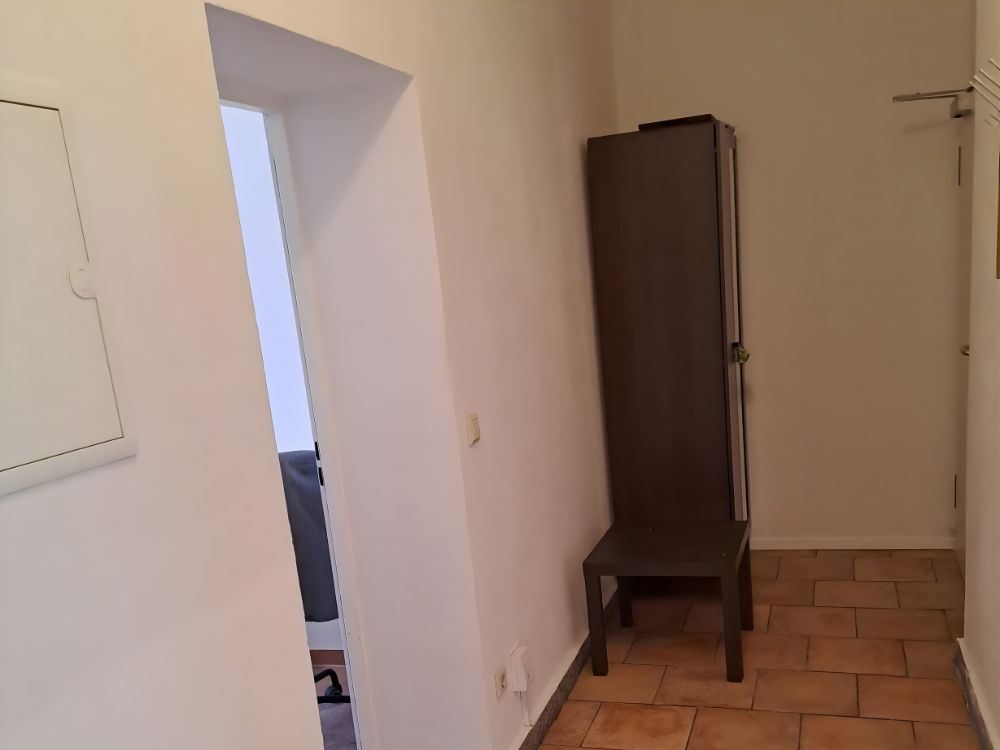 City Hideaways Ferienwohnung Mühle E1 Flur mit Garderobe