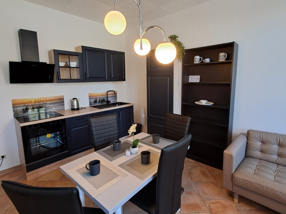 City Hideaways Ferienwohnung Mühle E1 Küche mit Essbereich