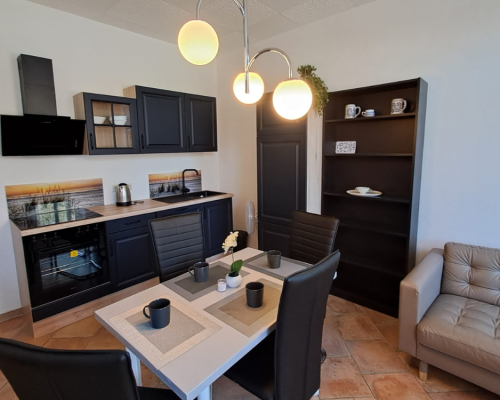 City Hideaways Ferienwohnung Mühle E1 Küche mit Essbereich